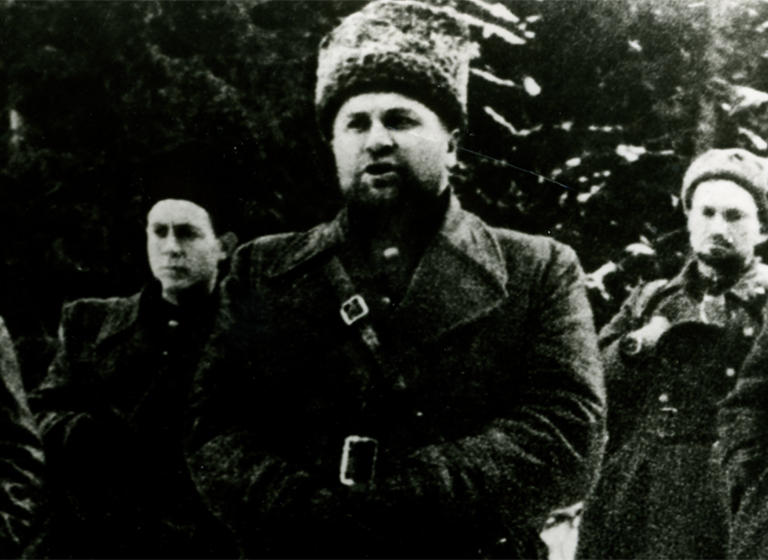 На фото: митинг, посвященный 27-й годовщине Великой Октябрьской социалистической революции. Словакия. 7 ноября 1944 года. Присутствовало 900 партизан. Выступает полковник А.Н. Асмолов. Слева - майор И.И. Скрипка