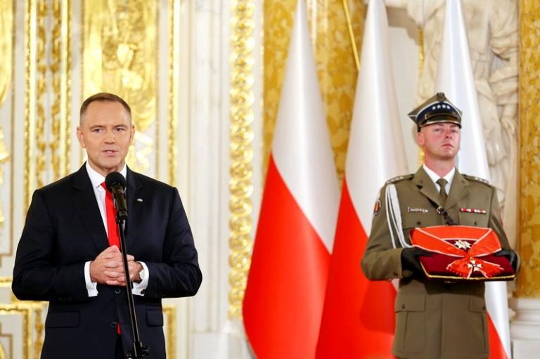 На фото: новоизбранный президент Польши Кароль Навроцкий 6 августа принес присягу перед Сеймом — парламентом страны.